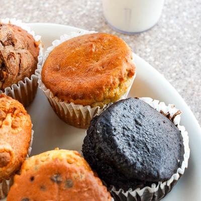 Assortment of freshly baked muffins served on a plate.