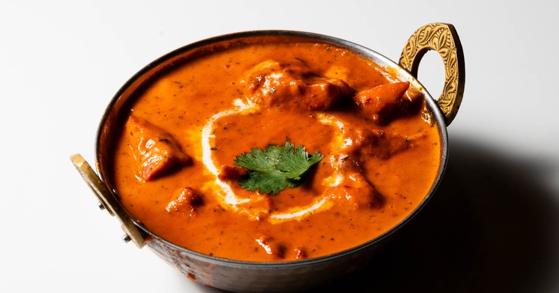 Creamy curry served in a traditional metal bowl
