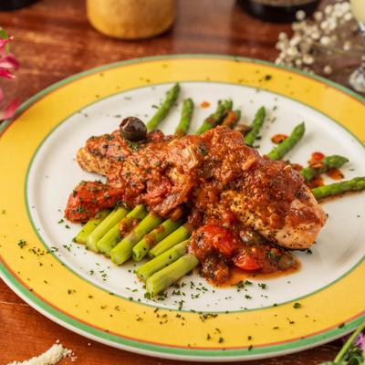 Chicken and asparagus in tomato sauce.