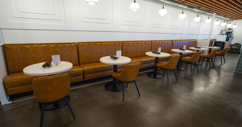 Interior, banquette seating, tables and chairs ready for guests