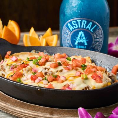 Taco Fiesta dish, with a blue bottle of tequila.