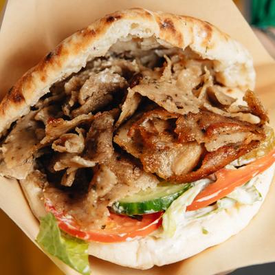 Chicken Shawarma sandwich served in pita with fresh vegetables.