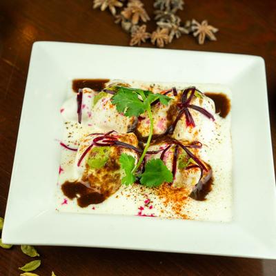 Lentil dumplings in yogurt sauce.