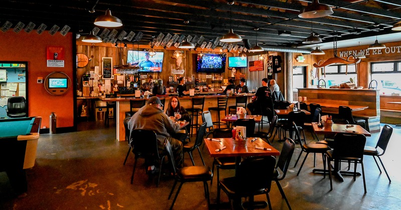 Interior, bar and dining area, guests enjoying their food and drinks