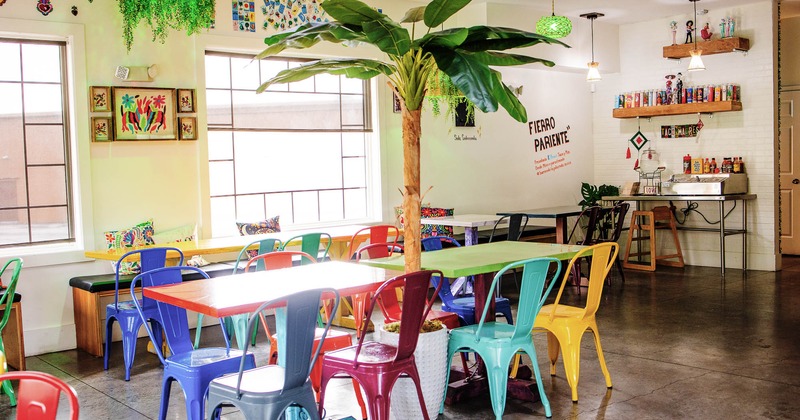 Seating area with colorful tables and chairs