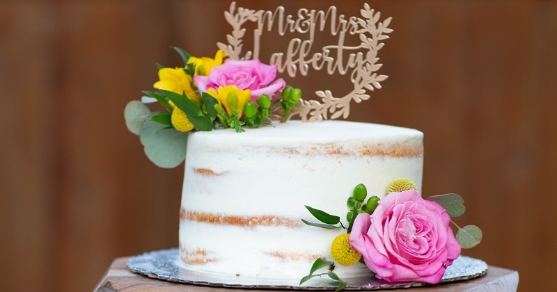 White wedding cake with floral decorations