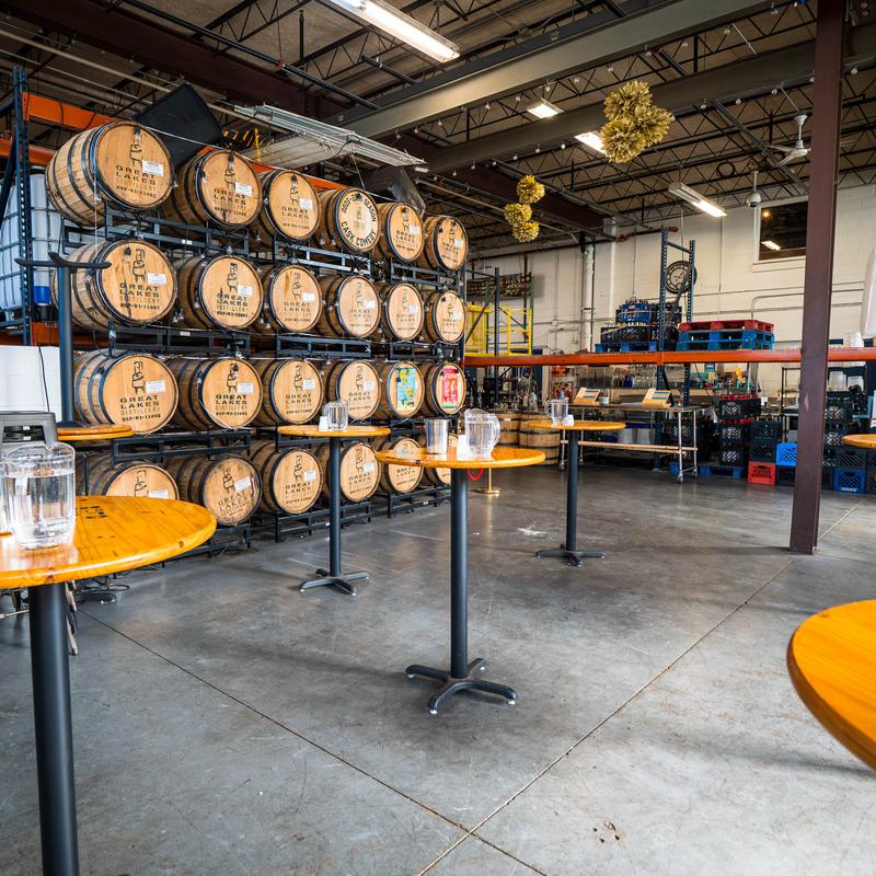 Interior, round tables with barrels in the back