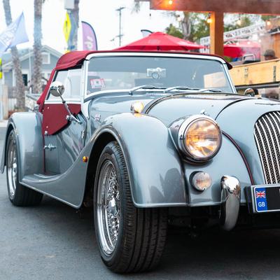 A vintage car parked outside.