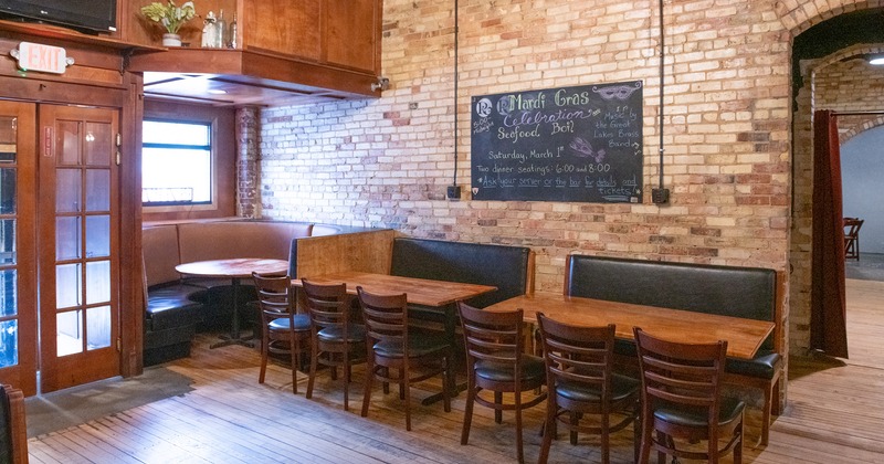 Interior, seating area with tables and upholstered seats