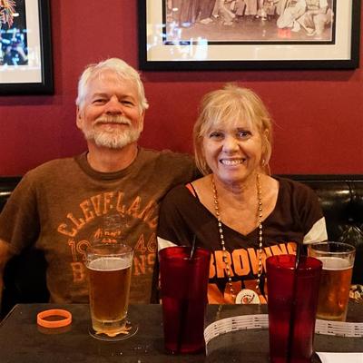 A smiling middle-aged couple posing for a photo