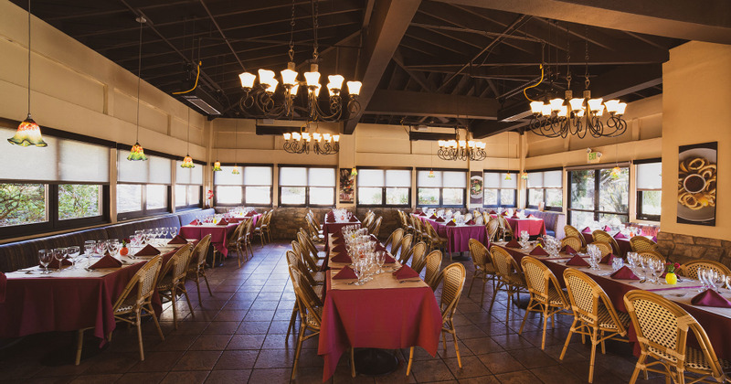 Dining area, tables set with tableware and ready for guests