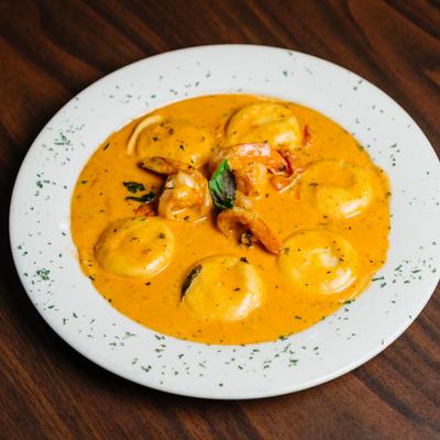 Lobster ravioli in creamy sauce, with shrimp.