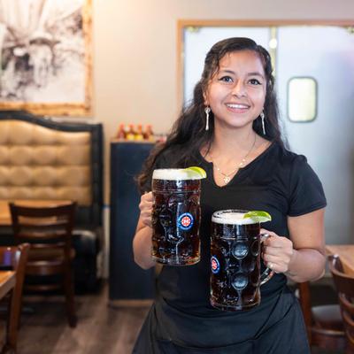 Bartender carrying beers.