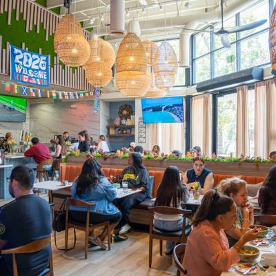 Indoor dining area featuring woven pendant lighting fixtures hanging from the ceiling.