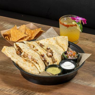 Quesadilla served with guacamole, sour cream, Pico de Gallo, tortilla chips and a margarita.