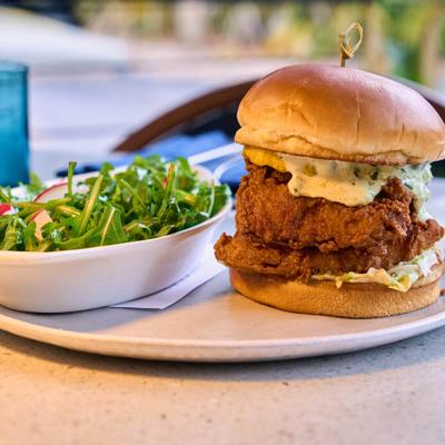 Fried fish sandwich and salad.