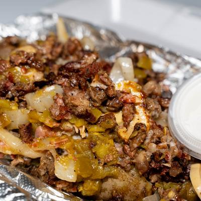 Grilled steak, with cheese, mushrooms, green chili, onion, and bacon.