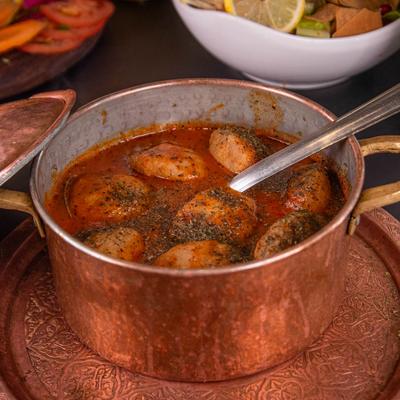 Lemon Kubba dish in a copper pot.