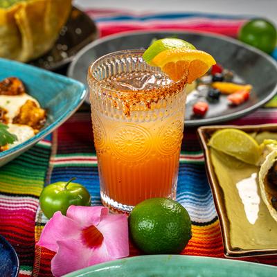 Blood Orange Margarita and various food.