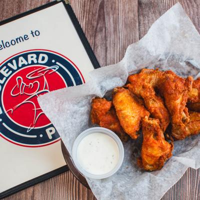 Spicy buffalo wings with ranch dipping sauce.