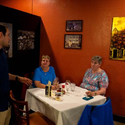 Employee tending to customers.
