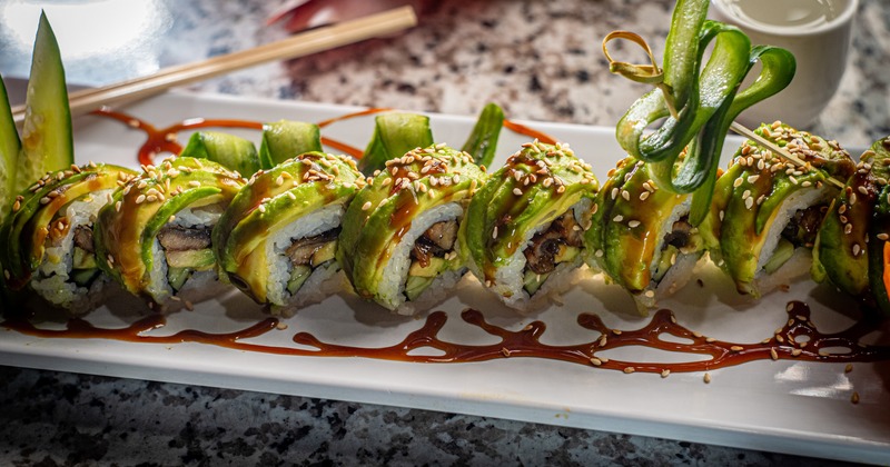 Eel sushi rolls, with cucumber, avocado, and eel sauce