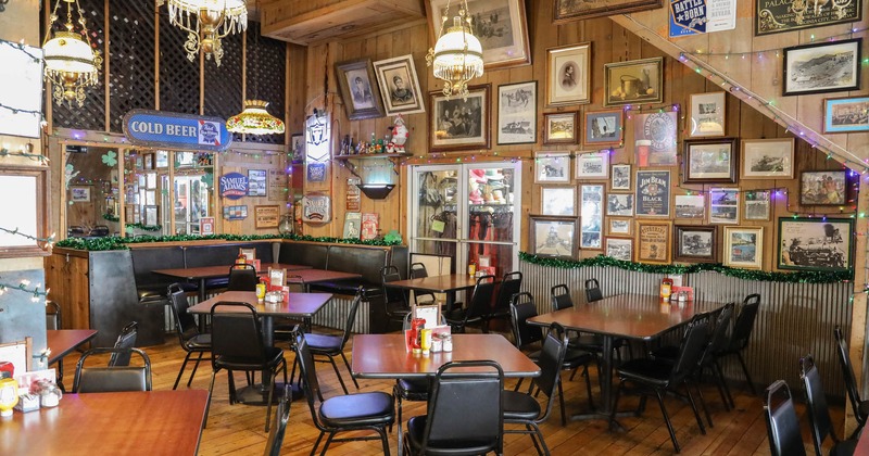 Interior seating space with chairs, tables and 1/2 circle booth