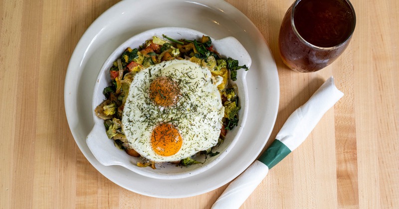 Sauteed veggies, topped with fried eggs