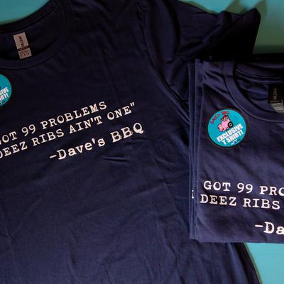 Navy blue t shirts with the print text I got 99 problems but deez ribs ain't one Dave's BBQ.