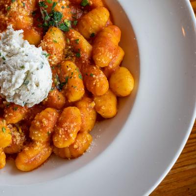 Potato gnocchi, tossed in tomato sauce, with fresh ricotta cheese