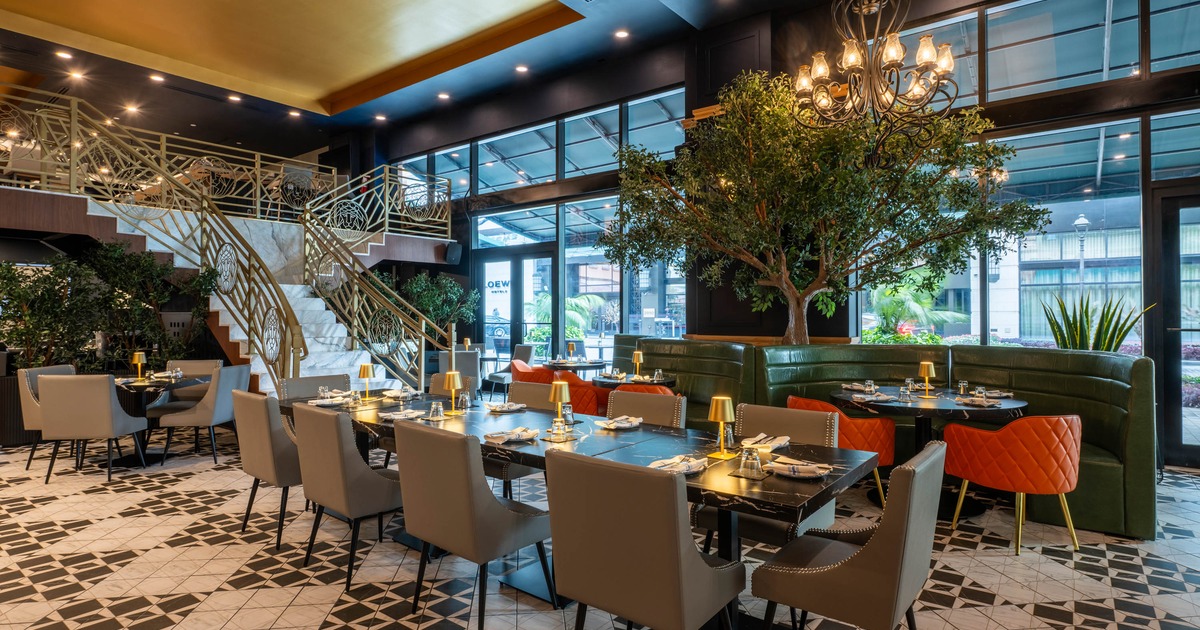 Interior, dining area, table for ten, banquette seating, staircase leading upstairs