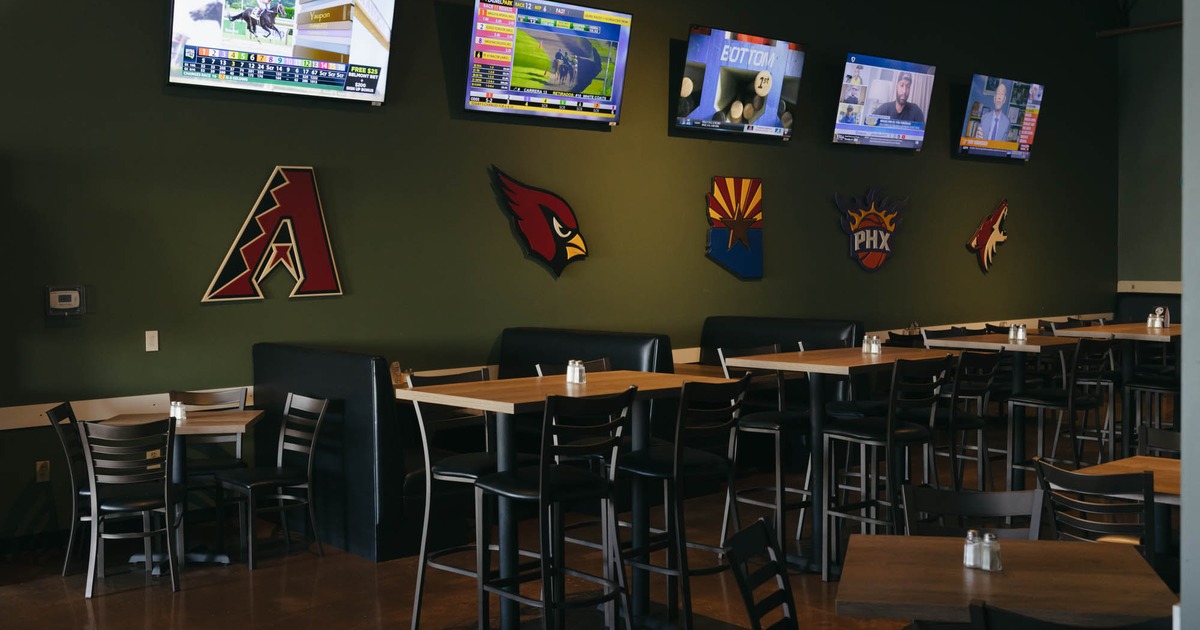 Interior seating area with chairs, tables and double booths