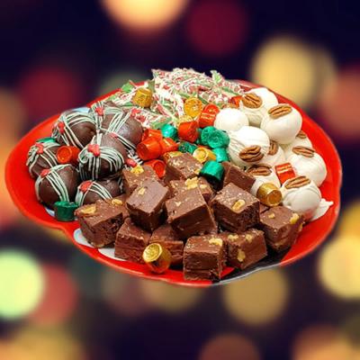 A festive red plate displays assorted holiday treats.