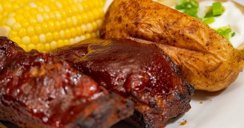 Ribs with corn and baked potato