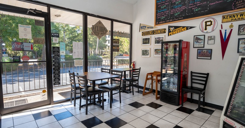 Interior, tables and chairs next to the window