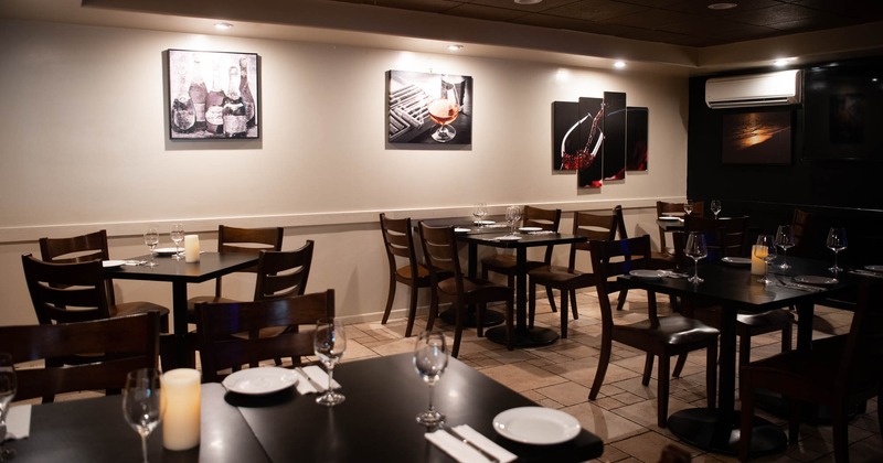 Indoor seating area next to the wall decorated with pictures