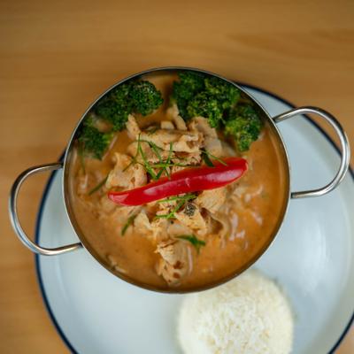 Panang curry with a side of rice.