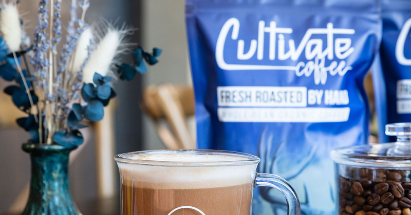 Cup of coffee and a bag of coffee beans