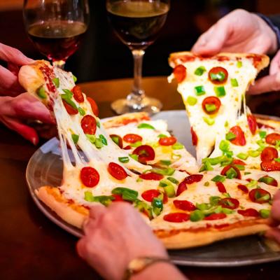 Delicious New York style pizza from Poor Richard's Restaurant.