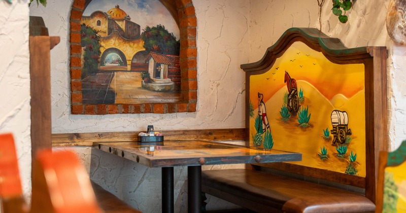 Restaurant booth with colorful murals