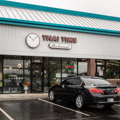 A car parked outside of the restaurant.