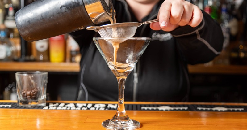 A bartender preparing Espresso Martini