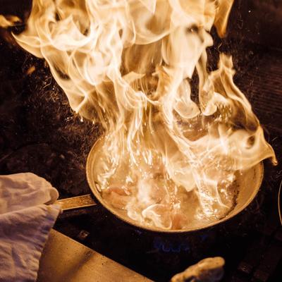 Flambe pan cooking.