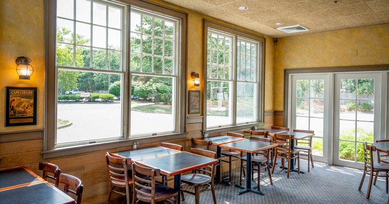 Interior, tables and chairs near the windows