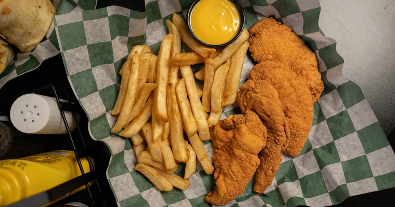 Chicken Strips with fries and sauce on the side
