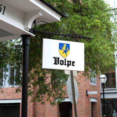 The restaurant's sign hanging outside.