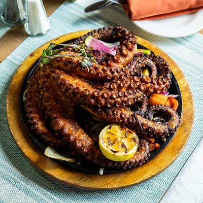 Octopus dish served on the table.