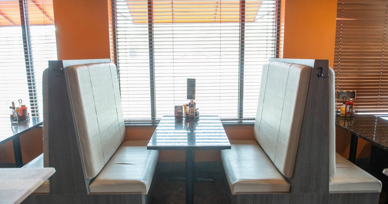 A restaurant dining booth setting