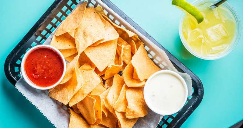 Nacho chips, with salsa, and sour cream