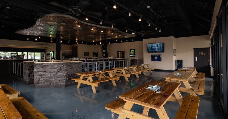 Interior, sitting area with long tables and benches